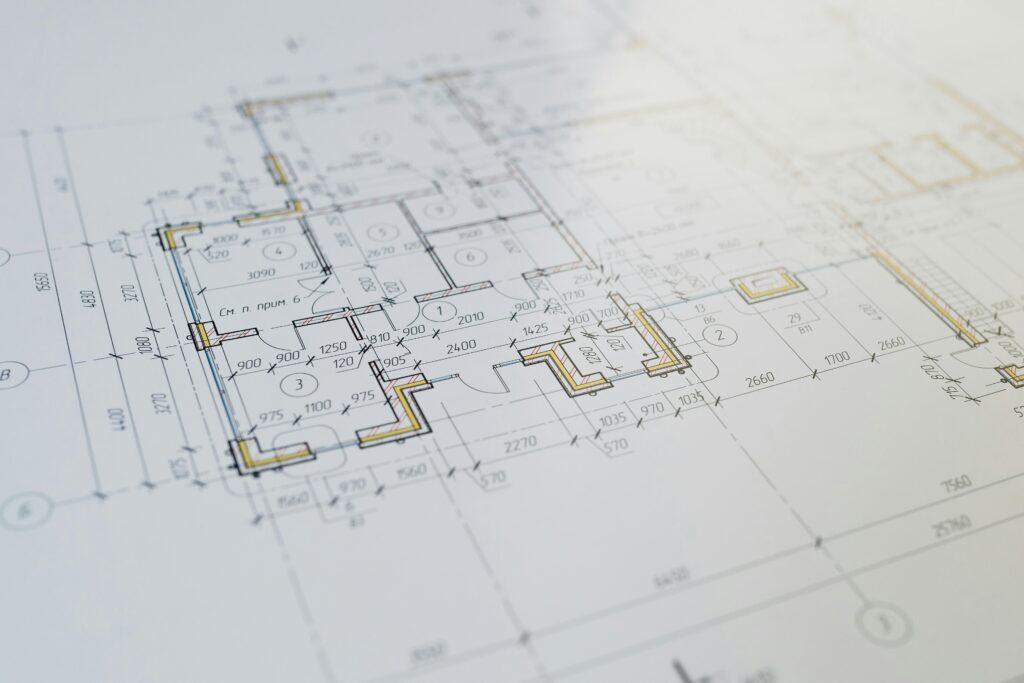 "Architect discussing project plans with clients during a construction consultation in Lucknow."
